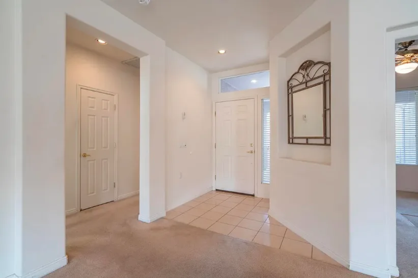 Updated interior entry and hallway with light finishes.