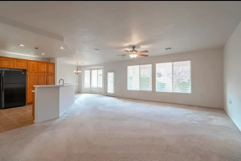 Open-plan living room and kitchen after remodeling.