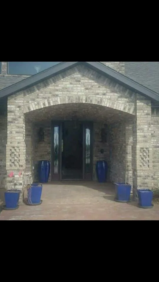Stone arched entry during exterior construction.