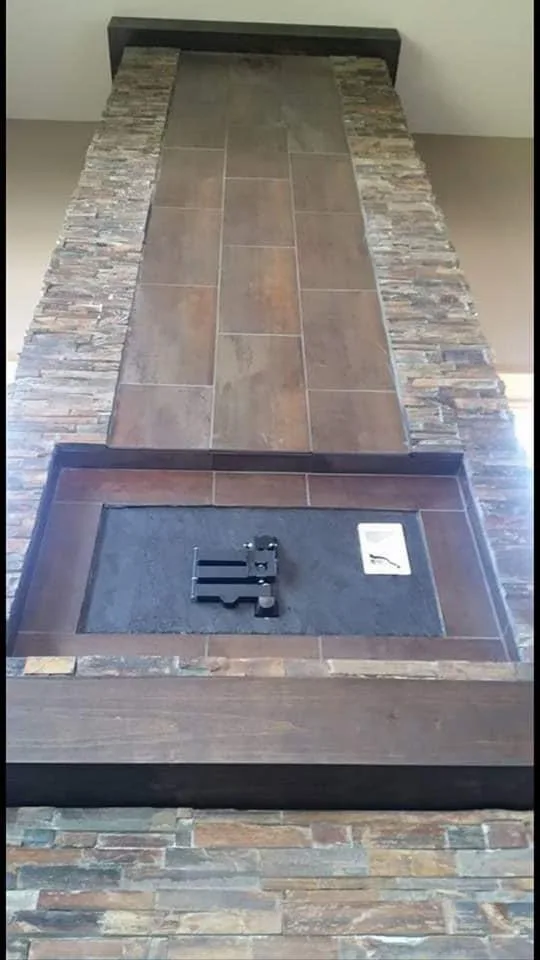 Stone fireplace hearth and metal firebox detail.