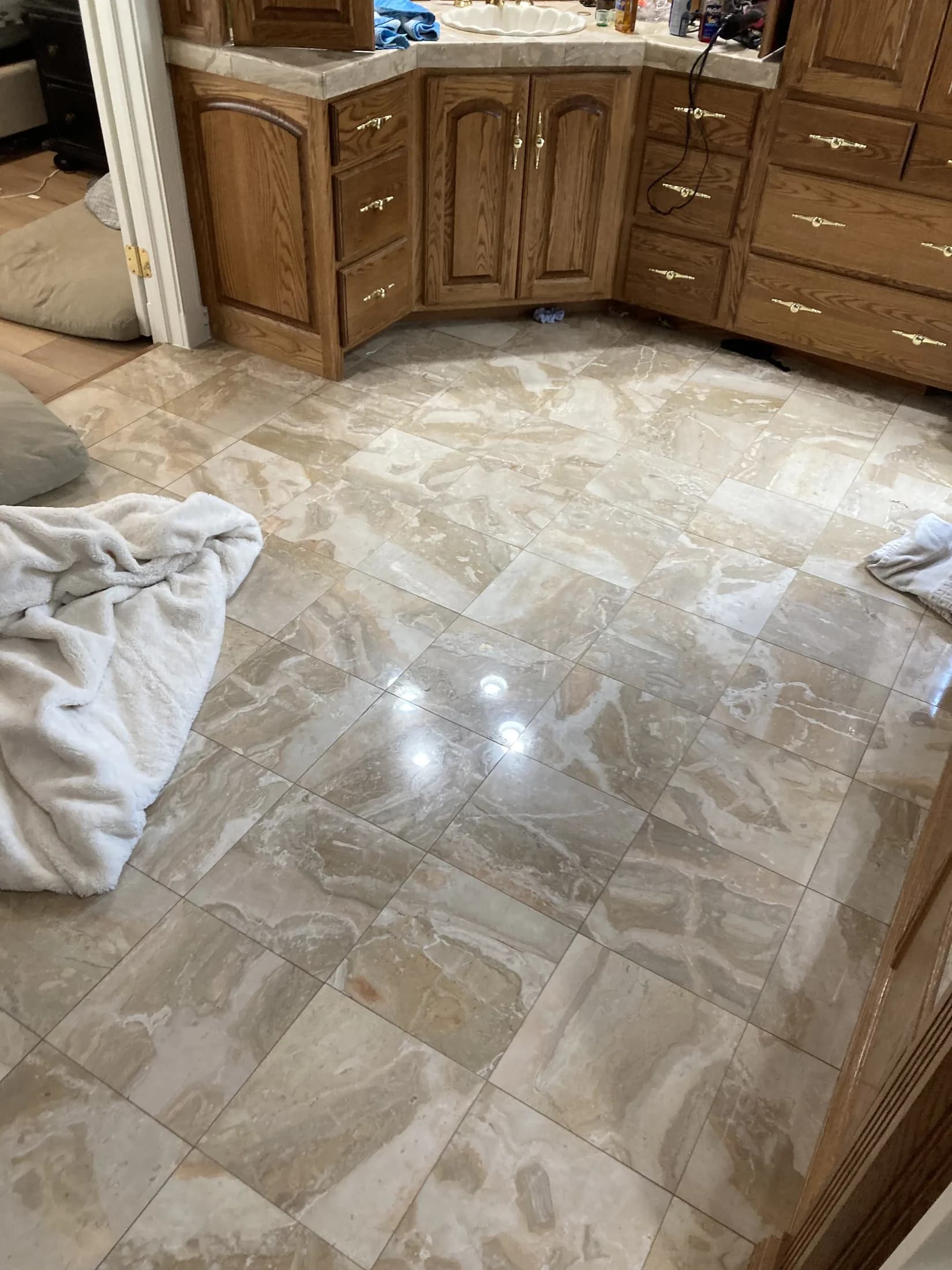 Stone-tile kitchen floor during installation.