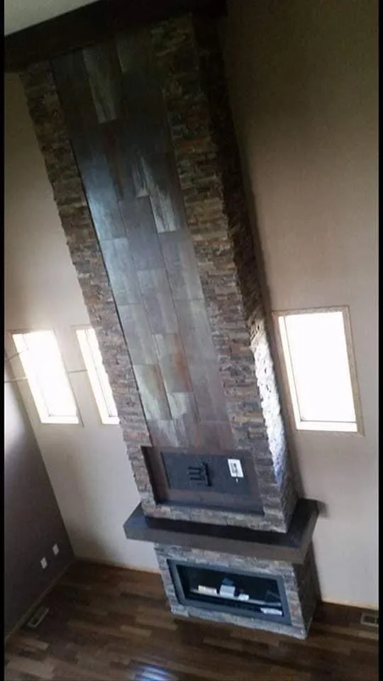 Tall fireplace surround during an interior renovation.