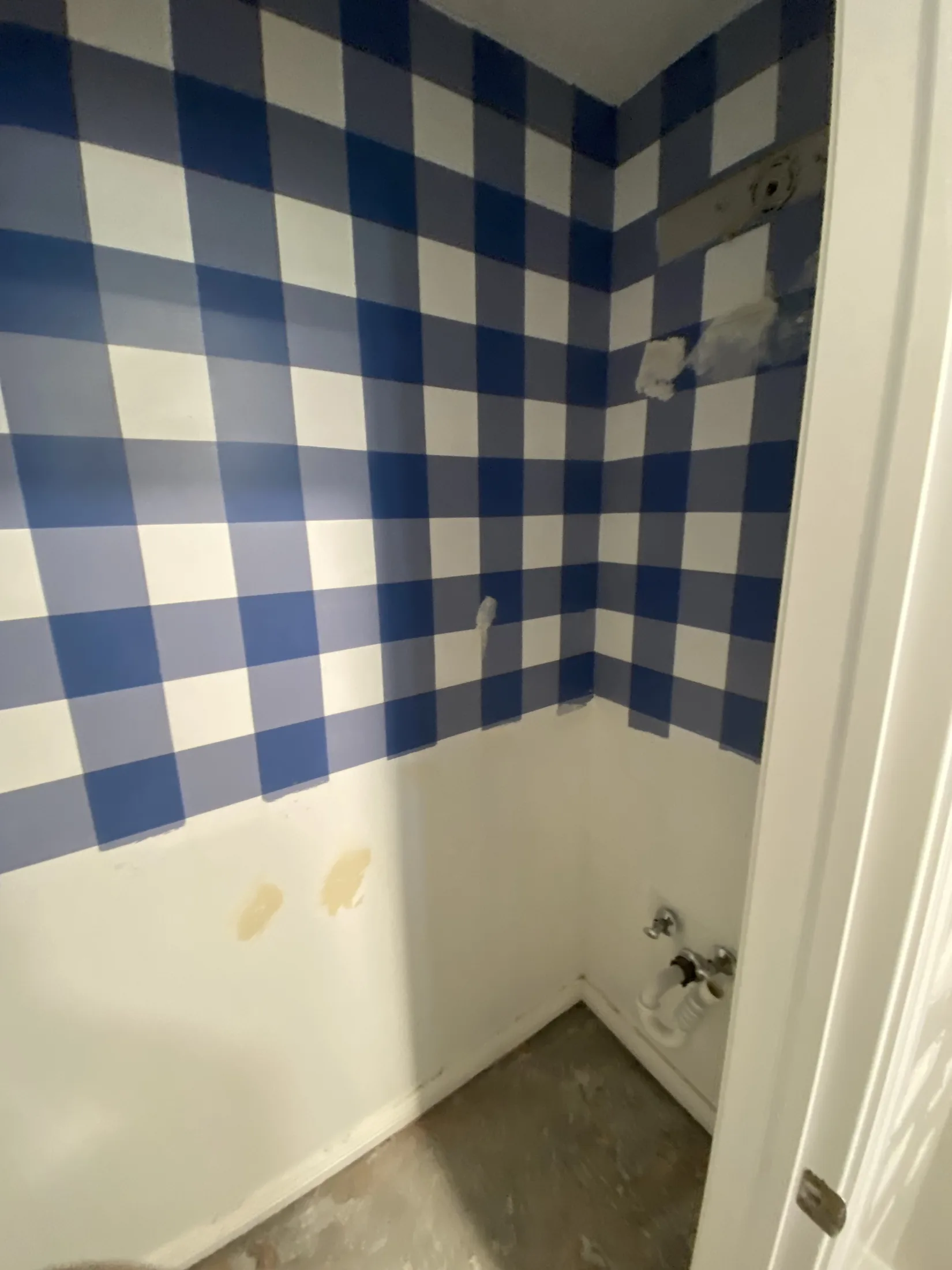 Tiled bathtub and shower surround during remodeling.